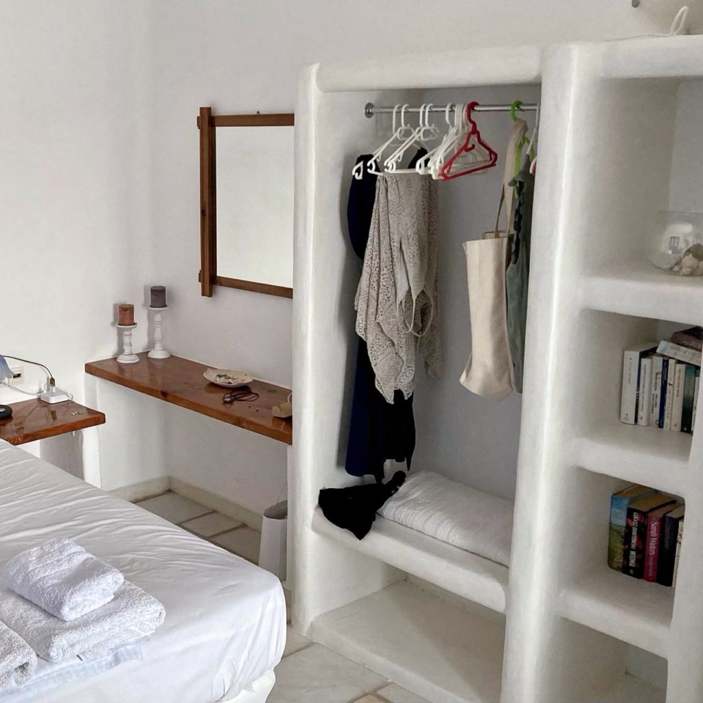 An open closet and bookshelves in our room in Paros, Greece